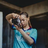 Atlanta Downes holding a camera